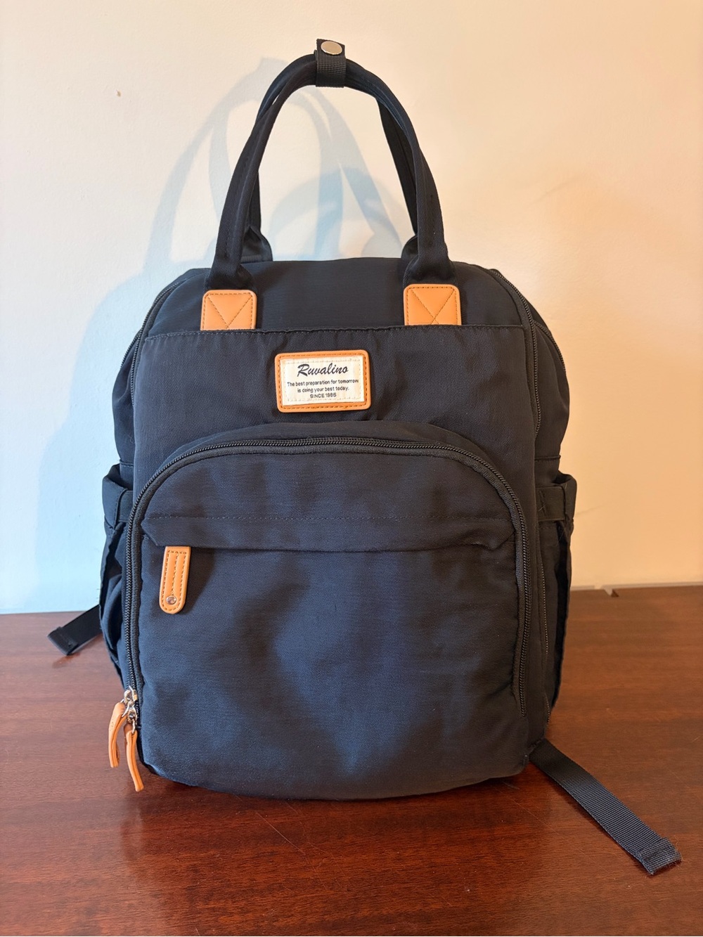 Ravalino Black Baby Diaper Backpack with Tan Accents